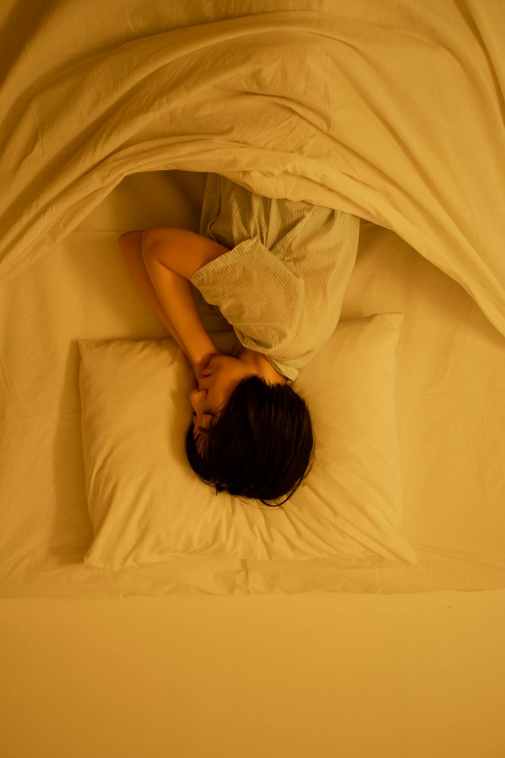Person sleeping peacefully in comfortable bed